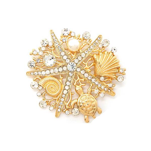 BEACH-THEMED BROOCH IS COMPOSED OF SEVERAL ICONIC SUMMER MOTIFS