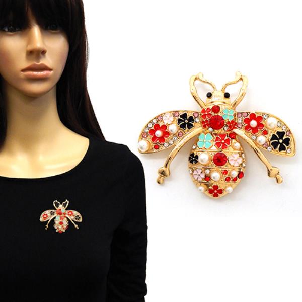 THE BROOCH IS SHAPED LIKE A HIGHLY DETAILED BEE WITH AN ORNATE, MULTICOLORED BODY AND WINGS