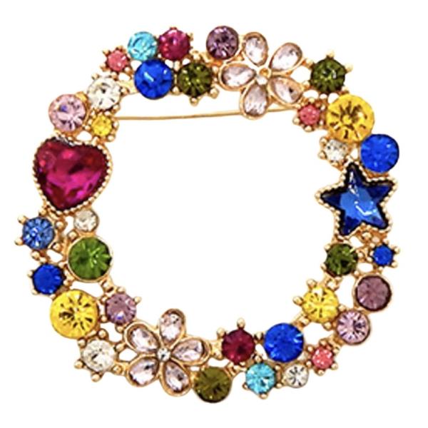 AN ORNATE CIRCULAR BROOCH ADORNED WITH SPARKLING CRYSTALS IN VARIOUS SHAPES INCLUDING FLOWERS, A STAR, AND A HEART
